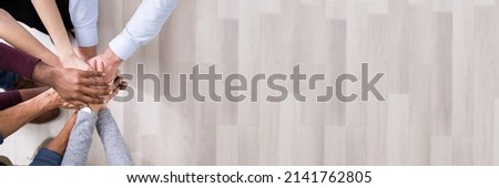 Close-up Of Many Hands Lying On Top Of Each Other Royalty-Free Stock Photo #2141762805