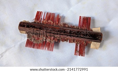 Traditional comb that has been damaged from bamboo and wood.
