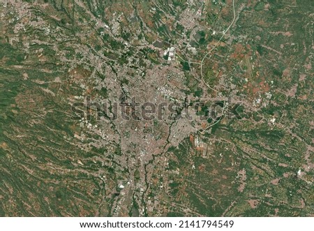 City of Malang from space. It shows region of Malang City in East Java Province, Indonesia. Source from satellite imagery. Suitable for background or wallpaper.