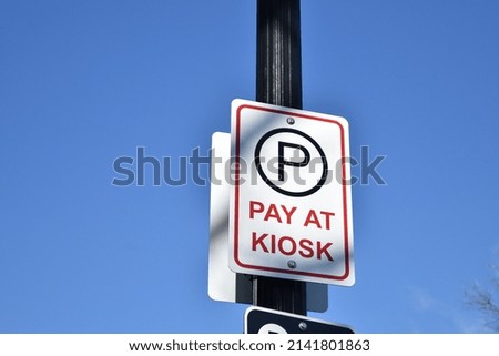 Street sign "PAY AT KIOSK"