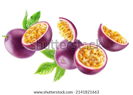 Group of flying ripe passion fruits whole and in half with leaves isolated on a white background. Royalty-Free Stock Photo #2141821663