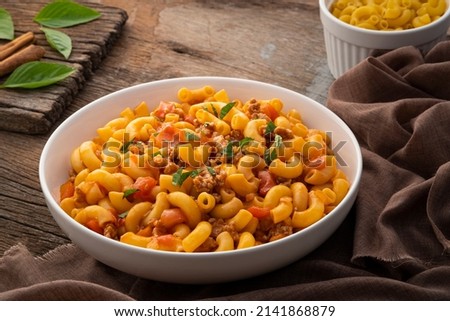 Stir fried macaroni with tomatoes sauce and mince pork on a plate Royalty-Free Stock Photo #2141868879