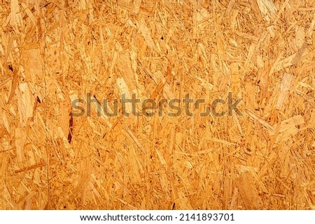Particleboard chipboard texture, waste-wood product, wood chips, sawmill shavings, sawdust surface