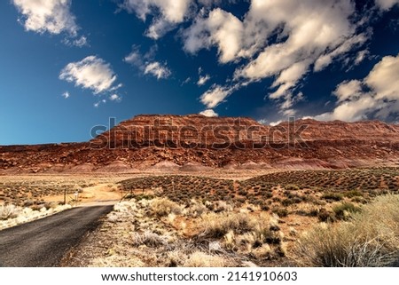 Contrasting rugged landscape of blue skies and red mountains, AZ, USA