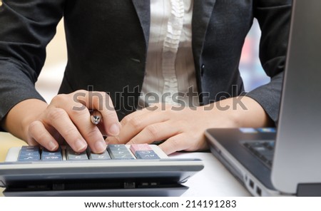 Business people hands working on the calculator