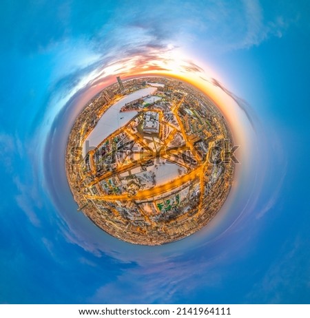 Aerial winter city view with crossroads and roads, houses, buildings, parks and bridges. Copter shot. Little planet sphere mode. Spherical panorama of the city, little planet. Yekaterinburg, Russia. Royalty-Free Stock Photo #2141964111