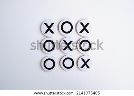 Tic-tac-toe close-up on a light background. The concept is so games for adults and children