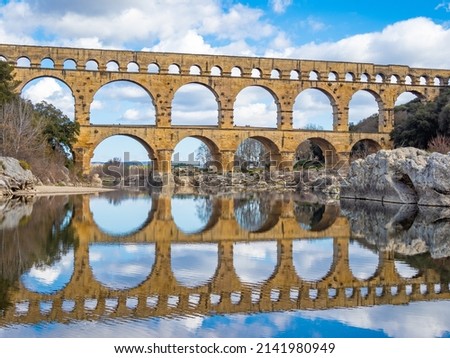 The magnificent Pont du Gard, an ancient Roman aqueduct bridge, Vers-Pont-du-Gard in southern France. Built in the first century AD to carry water to the Roman colony of Nemausus (Nîmes) Royalty-Free Stock Photo #2141980949