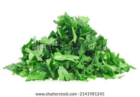 Pile of fresh chopped green parsley leaves isolated on a white background Royalty-Free Stock Photo #2141981245