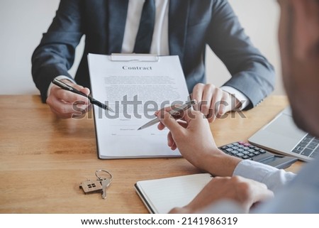Asian tenant, client man sign signature contract rental purchase, buyer home or apartment with landlord, realtor after banker agreement mortgage, loan success or done. Property lease agent concept.