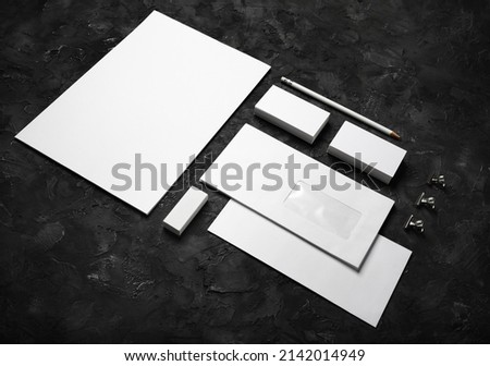 Blank corporate identity template on black plaster background. Photo of blank stationery set. Mockup for design presentations and portfolios.
