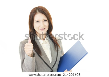 Smiling business woman with thumbs up
