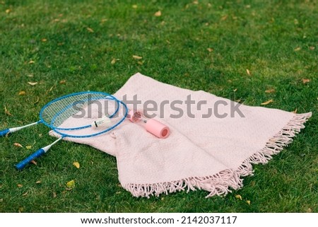 the concept of warm and cozy plaids in nature in the park for outdoor activities or a picnic 
