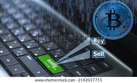 Keyboard Saudi Arabia with flag on enter button with bitcoin coin hologram and online buy and sell concept.