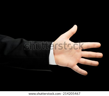 Caucasian male hand in a business suit showing number five with fingers, low-key lighting composition, isolated over the black background