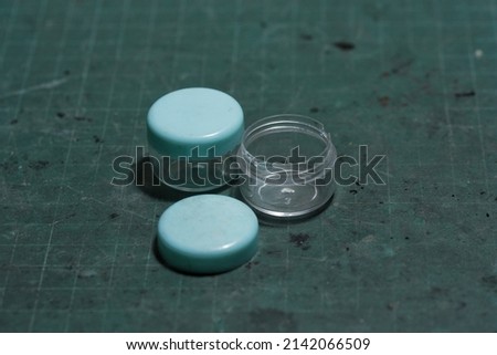 Small containers with lids for portability