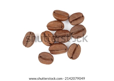 close-up top view The texture a pile of freshly roasted coffee beans. isolated on a white background