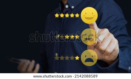 Customer touch smile emoticon for rating on blue background. Service rating, feedback, satisfaction concept