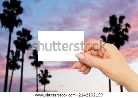 Hot summer horizontal business card mock up. Travel and vacation themes. Woman hand on Malibu landscape