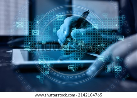 Businessman using tablet computer with envelope icon on a world map interface. Global business and information technology concept