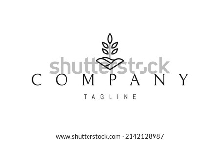 Vector logo on which an abstract image of a plant on the background of a plowed field.
