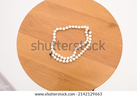 translator pearl beads on a wooden background
