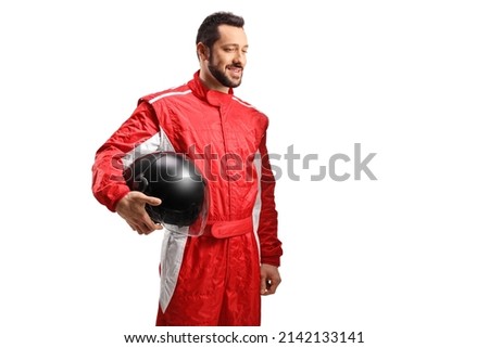 Smiling racer in a red suit holding a black helmet and looking to the side isolated on white background Royalty-Free Stock Photo #2142133141