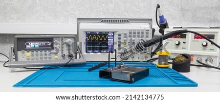 Power supplies and electronic measuring devices in the laboratory Royalty-Free Stock Photo #2142134775