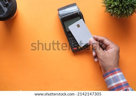 Card payment machine for advertising materials