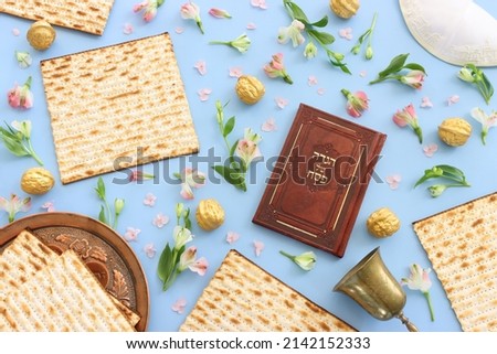 Pesah celebration concept (jewish Passover holiday). Translation of Traditional pesakh book with text: passove tale Royalty-Free Stock Photo #2142152333