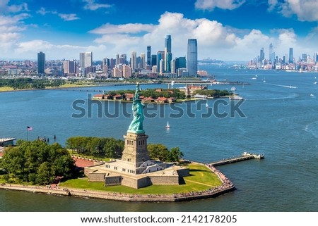 Panoramic aerial view Statue of Liberty and Jersey City and Manhattan cityscape in New York City, NY, USA Royalty-Free Stock Photo #2142178205