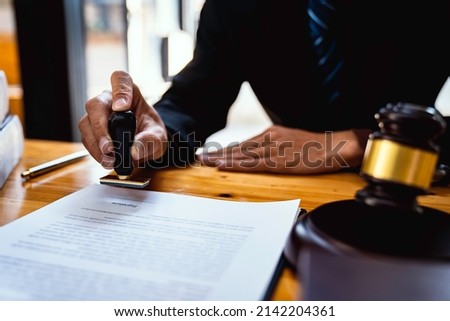 Lawyer working with documents. Justice and law concept. Attorney working with contract papers and stamp