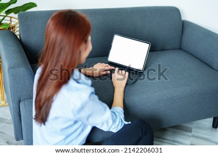 online learning, shopping, meeting, information searching, Asian woman using a white screen tablet can insert text, characters or images