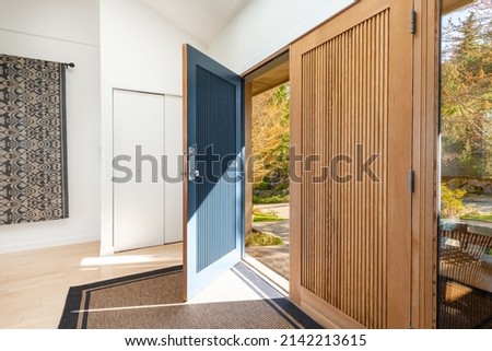 Scandanavian style home interiors living room kitchen bedroom and foyer front entry Royalty-Free Stock Photo #2142213615