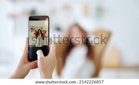 Young asian womans shooting together dancing in kitchen at house when making video for social media, stories trendy dance at home make online content Royalty-Free Stock Photo #2142226857