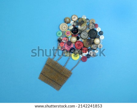                               balloon made from colorful buttons on blue background