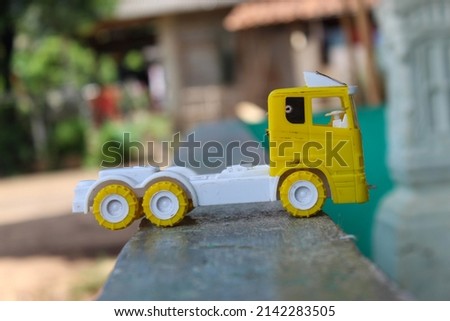 small yellow and white children's toy truck car