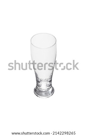 Detailed shot of a transparent beer glass tapering at the top. The designer tall beer mug is isolated on the white background.