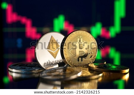 Bitcoin and cryptocurrency investing concept. Bitcoin cryptocurrency coins. Trading on the cryptocurrency exchange. Trends in bitcoin exchange rates. Rise and fall charts of bitcoin. Royalty-Free Stock Photo #2142326215