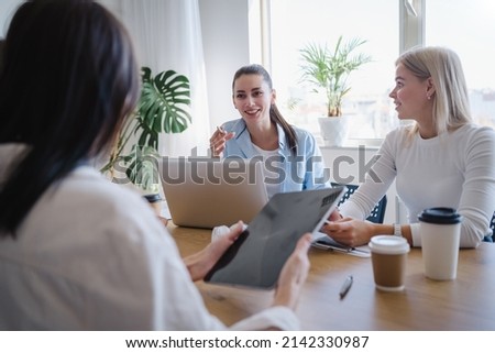 Low angle of managers sitting in the office and listening each other while having discussion for their project. Business and colleagues concept  Royalty-Free Stock Photo #2142330987