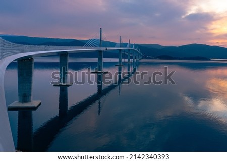 Reflections of the Pelješac Bridge Royalty-Free Stock Photo #2142340393