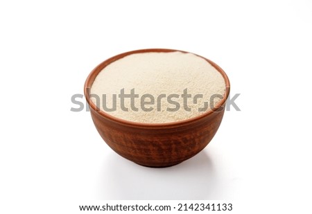 Semolina in bowls and bags isolated on a white background. High quality photo