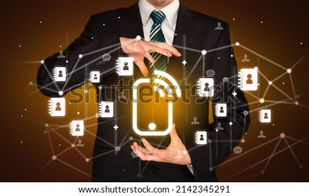 Hand holding social media icons