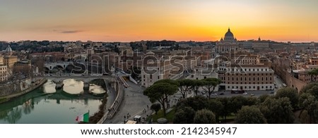 A panorama picture of the Vatican and the Tiber river at sunset.