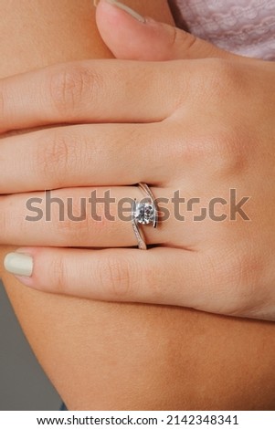 Diamond engagement ring on hand
