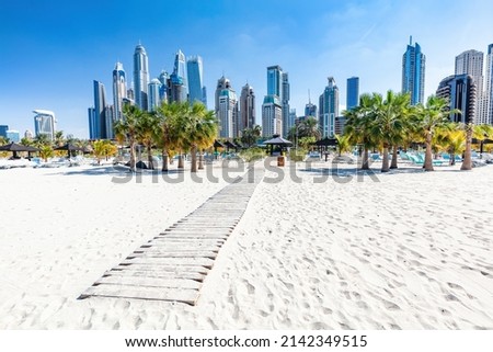 Dubai jumeirah beach with marina skyscrapers in UAE. Popular public JBR beach Royalty-Free Stock Photo #2142349515