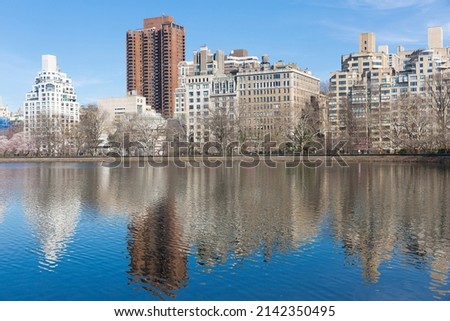 New York city, USA - April 2nd 2022: Beautiful view of Jacqueline Kennedy Onassis Reservoir with Manhattan buildings in Central Park.