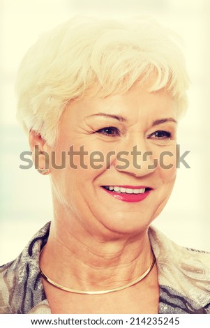 Portrait of elder woman. Isolated on white.