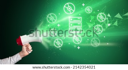 Young person with megaphone and technology related icon