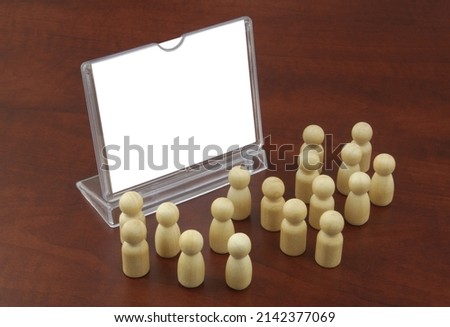 Advertising stand with copy space for text and wooden people figures. Mock up template.